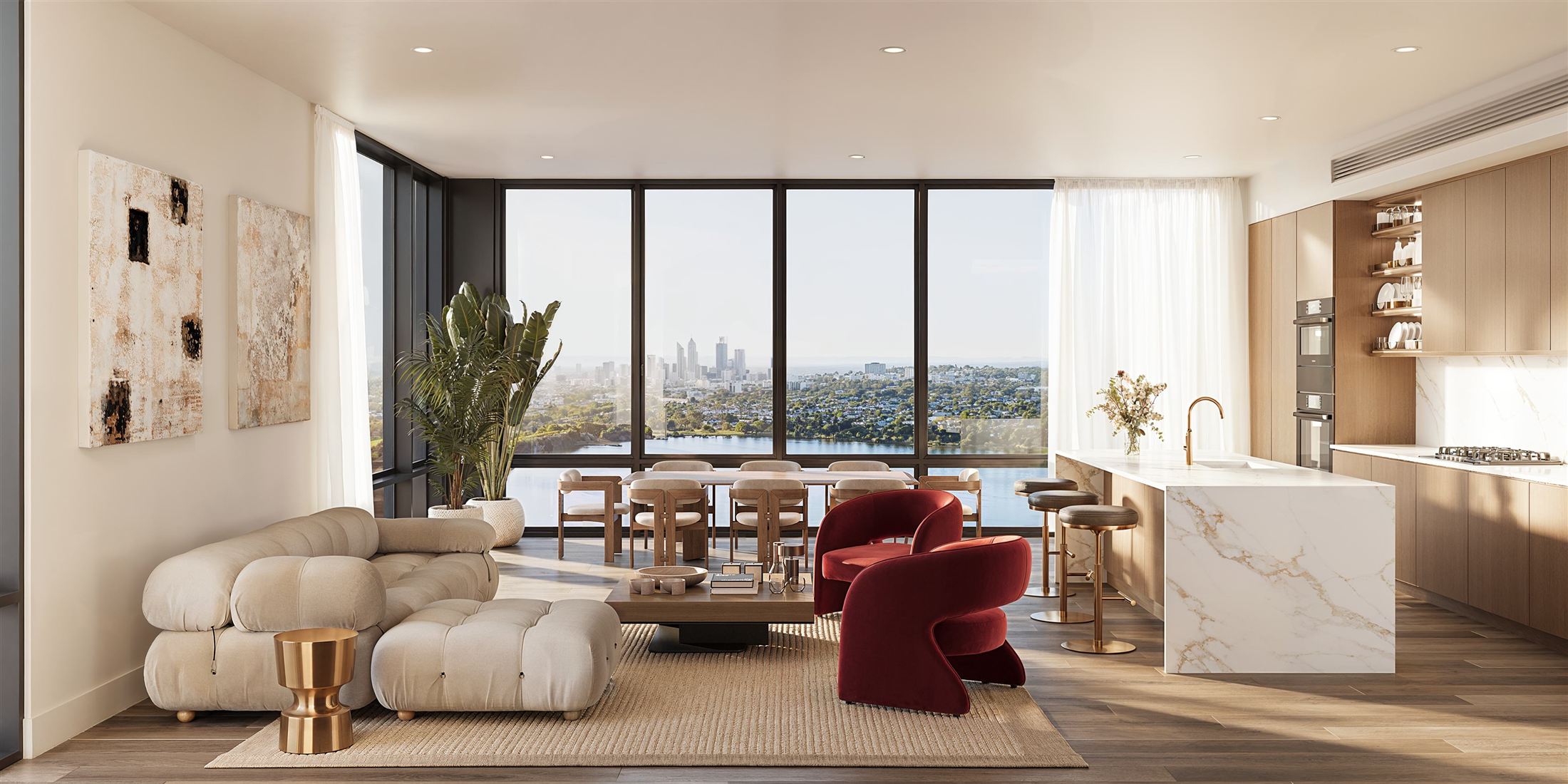 Bright condominium living room and kitchen overlooking a city skyline